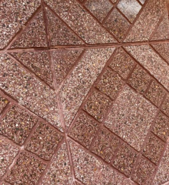 Close-up view of a patterned tile floor, showcasing intricate designs suitable for construction and remodeling projects.