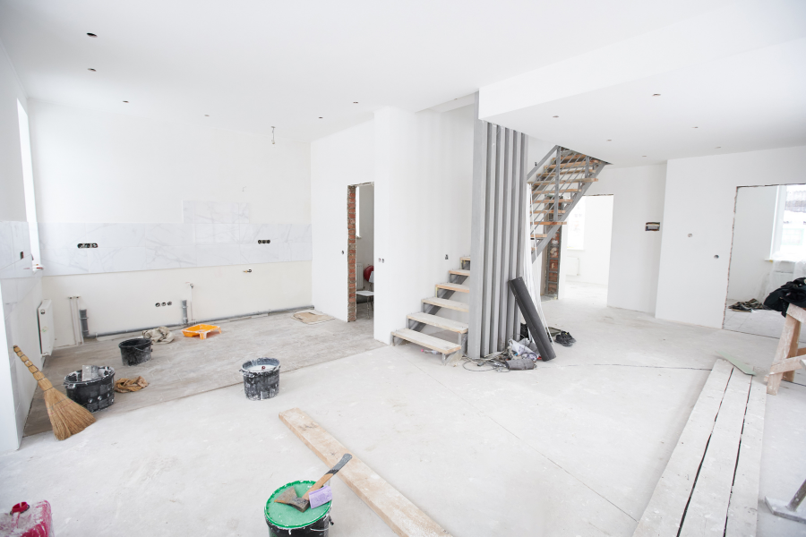 Interior view of a room with a staircase and ladder, highlighting design aspects for Greater Mansion, a Brooklyn contractor.